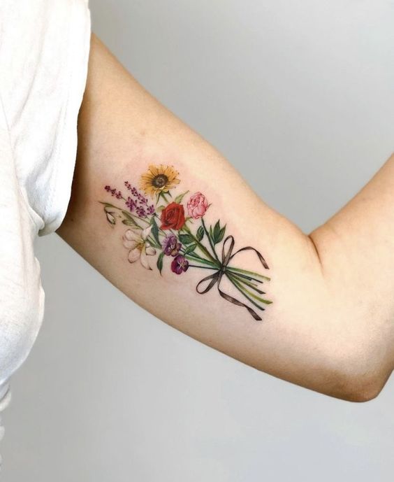 Discover 24 Stunning Flower Bouquet tattoo ideas: Delicate, Colorful, and minimalist Designs