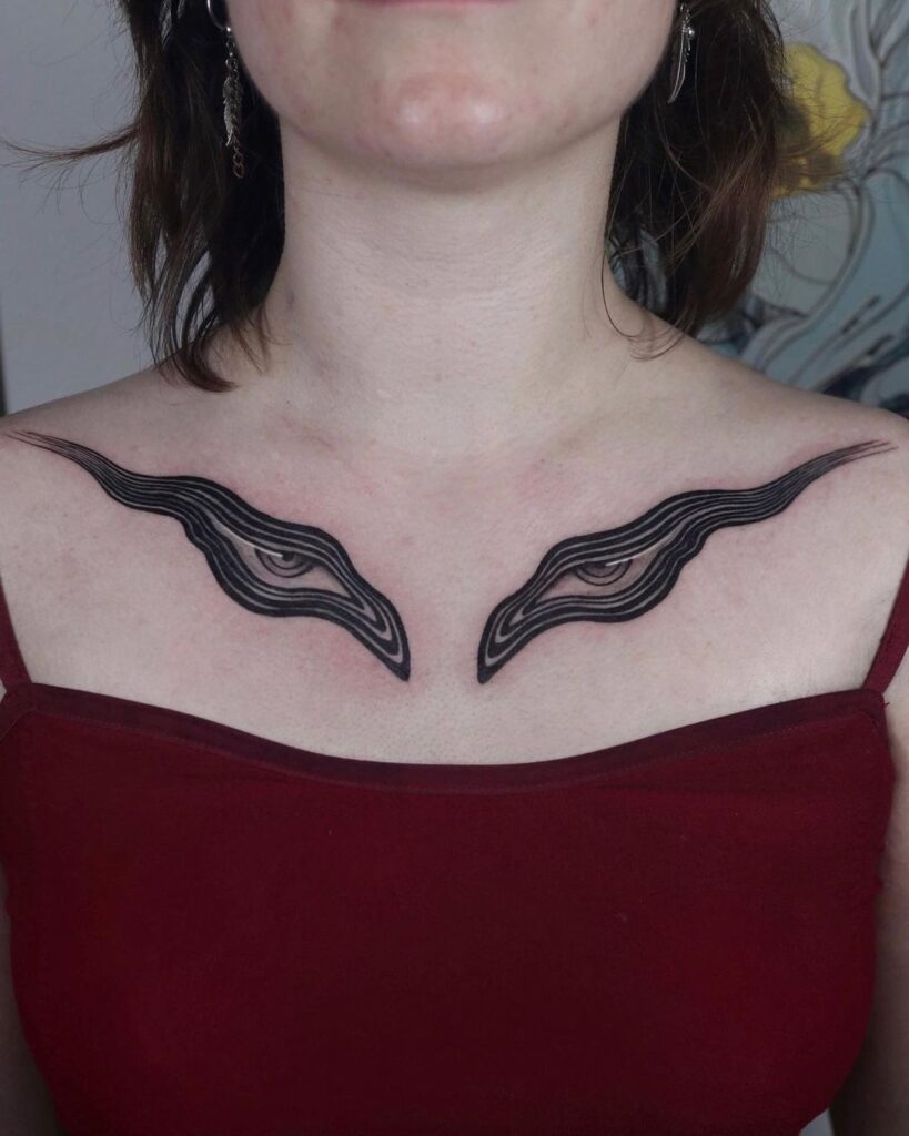 Abstract realistic eye tattoo collarbone art for women 