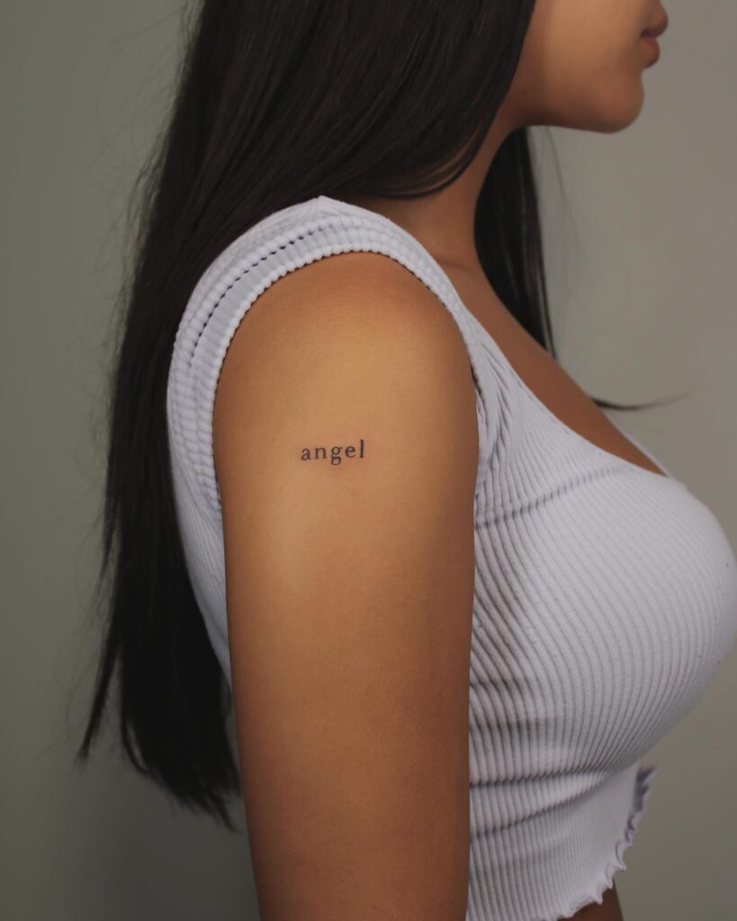 Angelic grace clean angel word lettering tattoo on the upper arm 