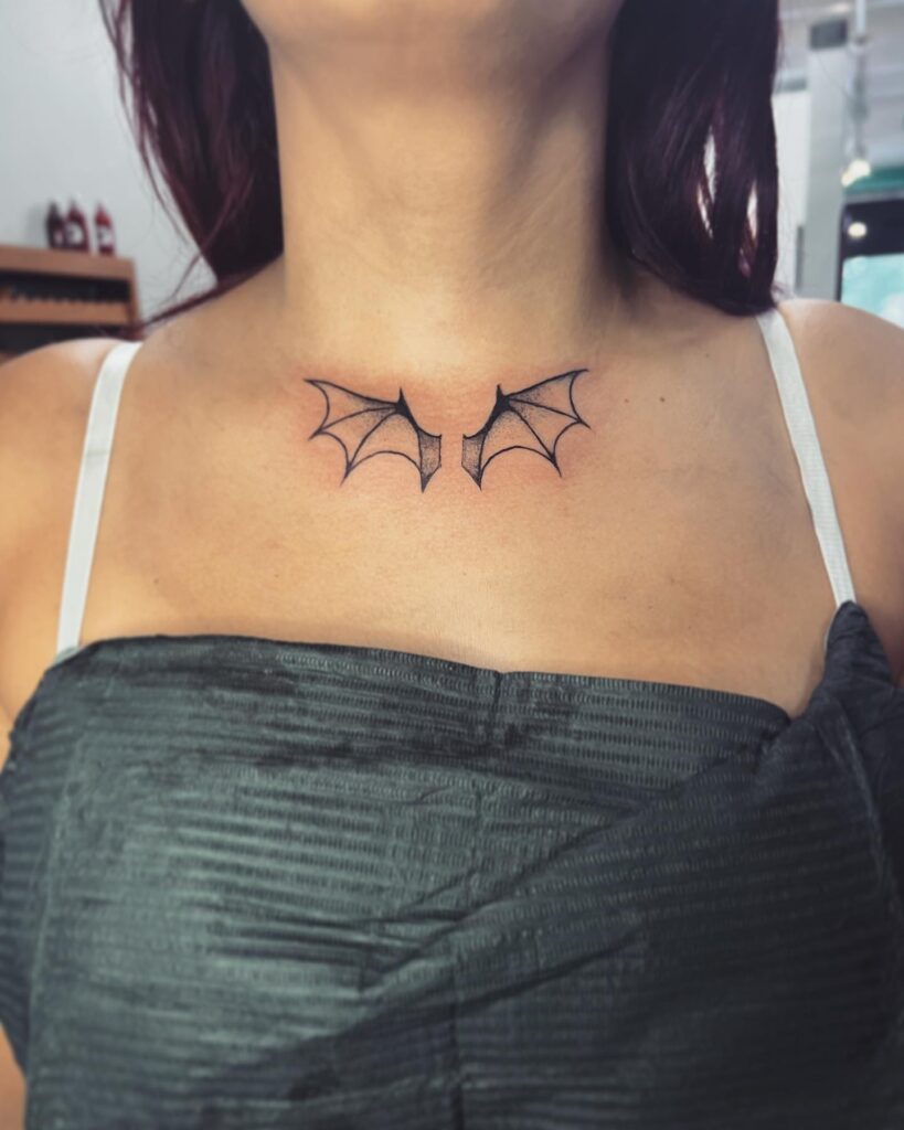 Beautiful Bat Wings Tattoo Below the Throat for a Feminine Touch: Ethereal Elegance 
