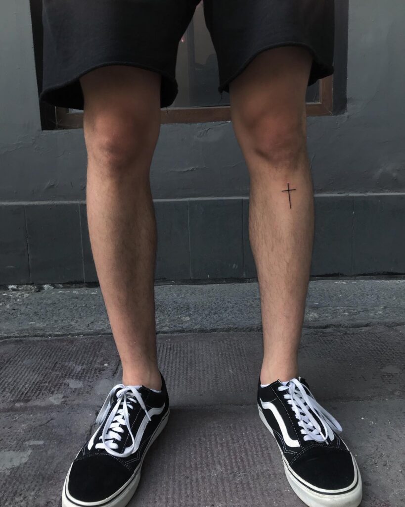 Below Knee Simple Cross Tattoo Masculine Symbolism 