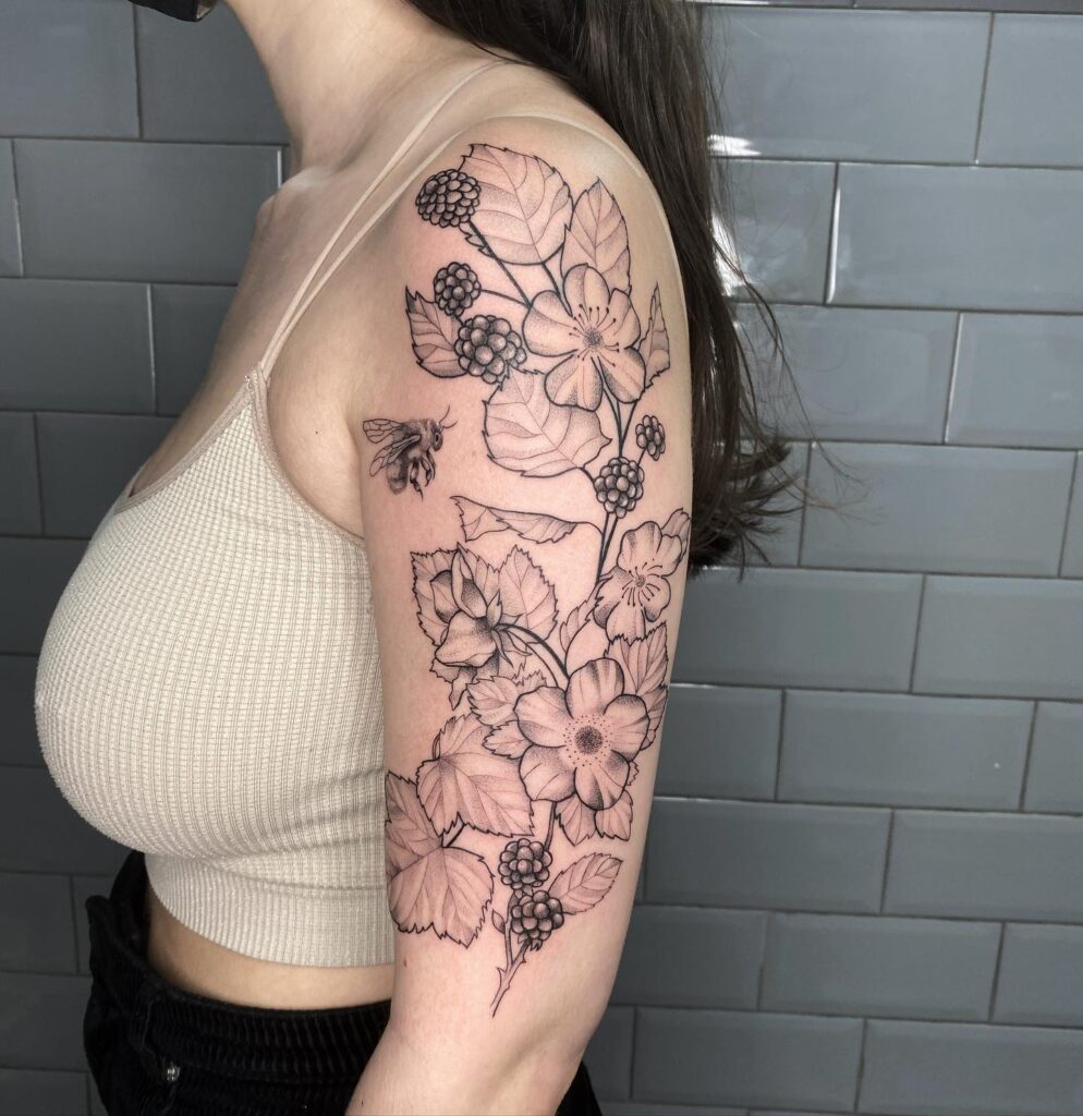 Berries and blooms half sleeve black line floral tattoo art 
