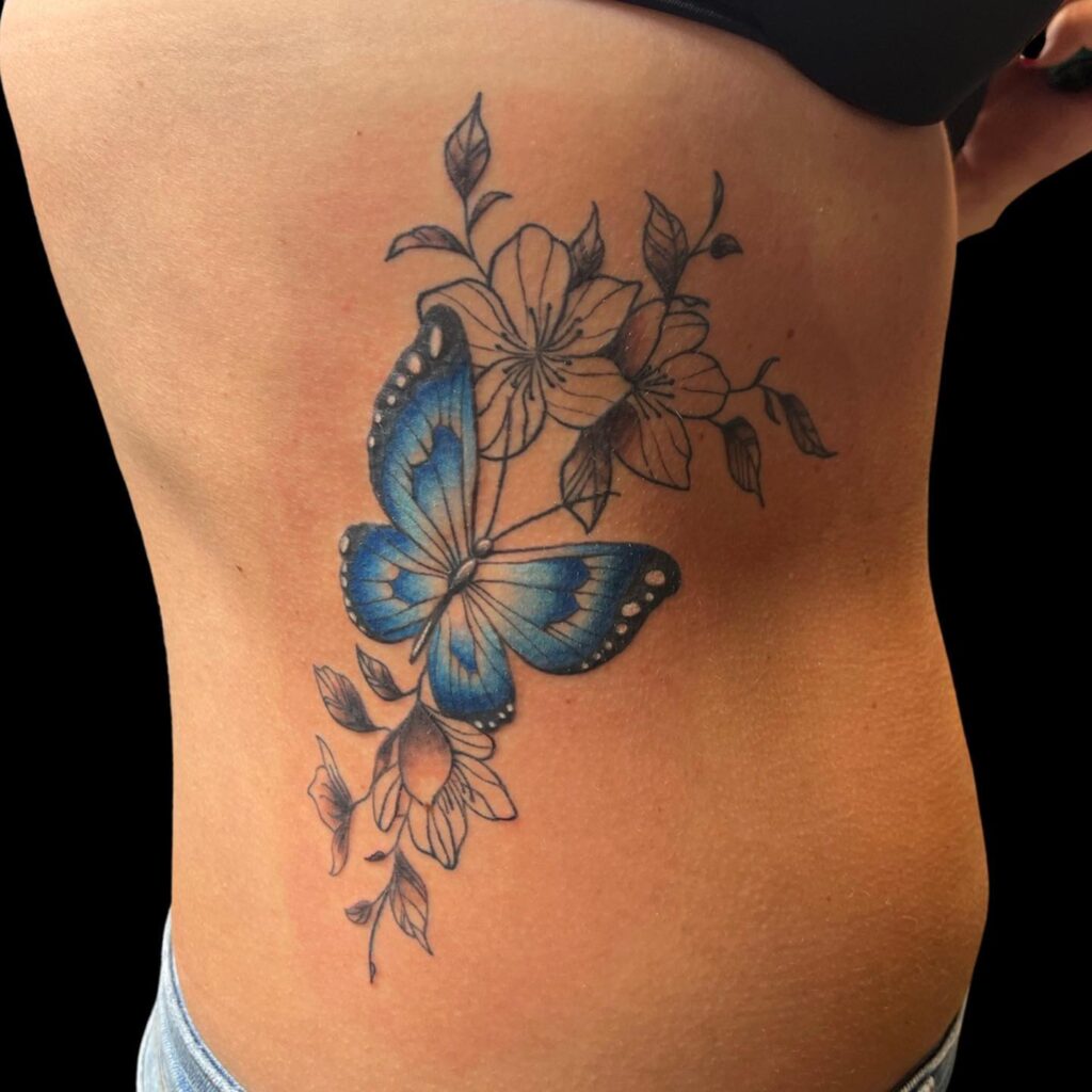 Blue Butterfly Tattoo on Ribs for Females 