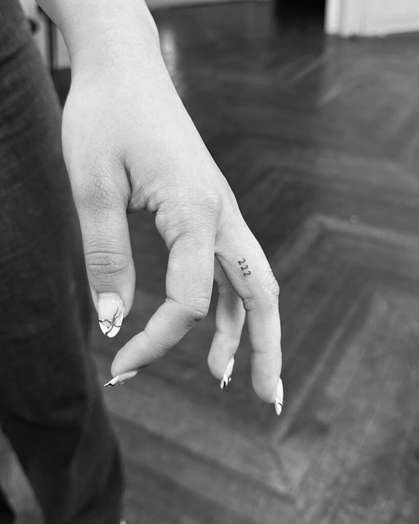 Decoding the meaning behind the 222 number tattoo on the middle finger