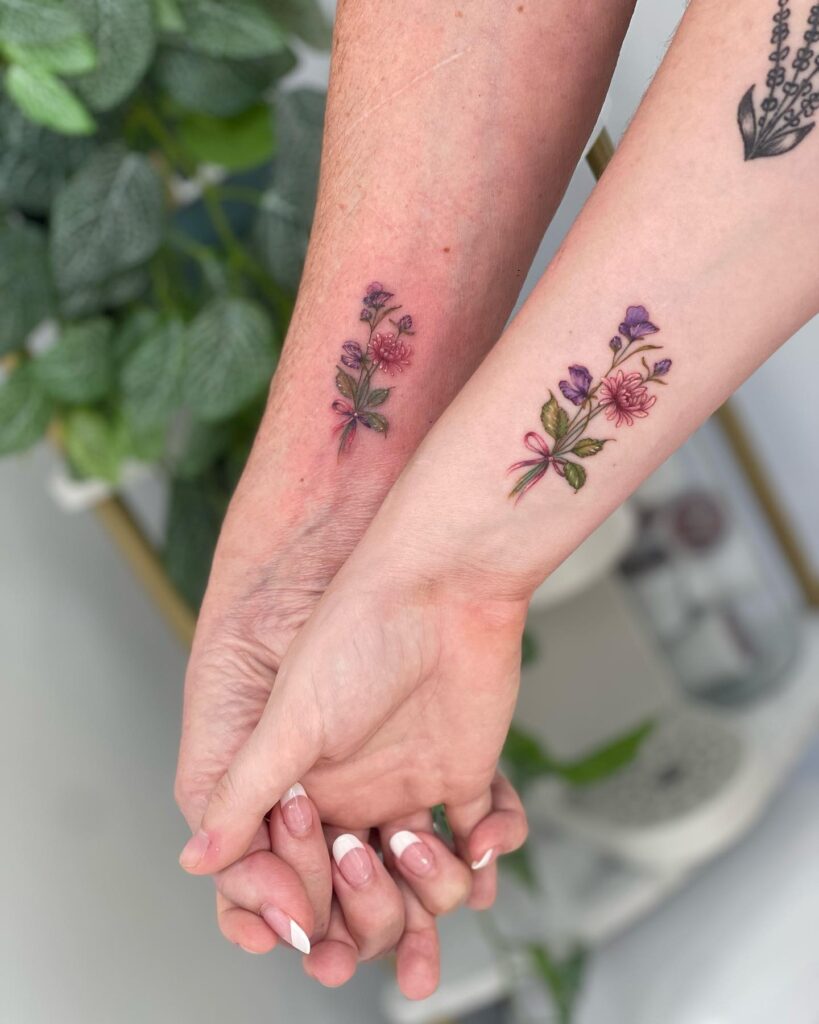 Delicate Floral Bouquet Mother Daughter Tattoos Symbolizing Love and Growth 