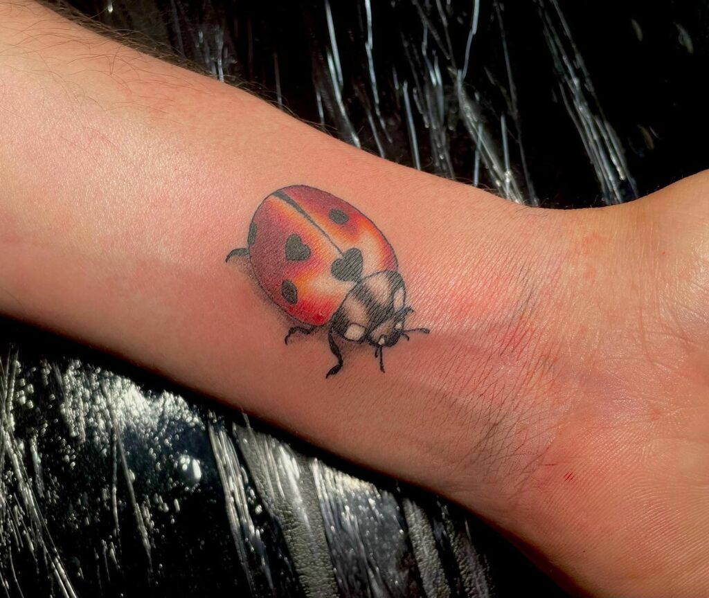 Delight Colorful Ladybug Wrist Tattoo A Whimsical Touch of Nature 