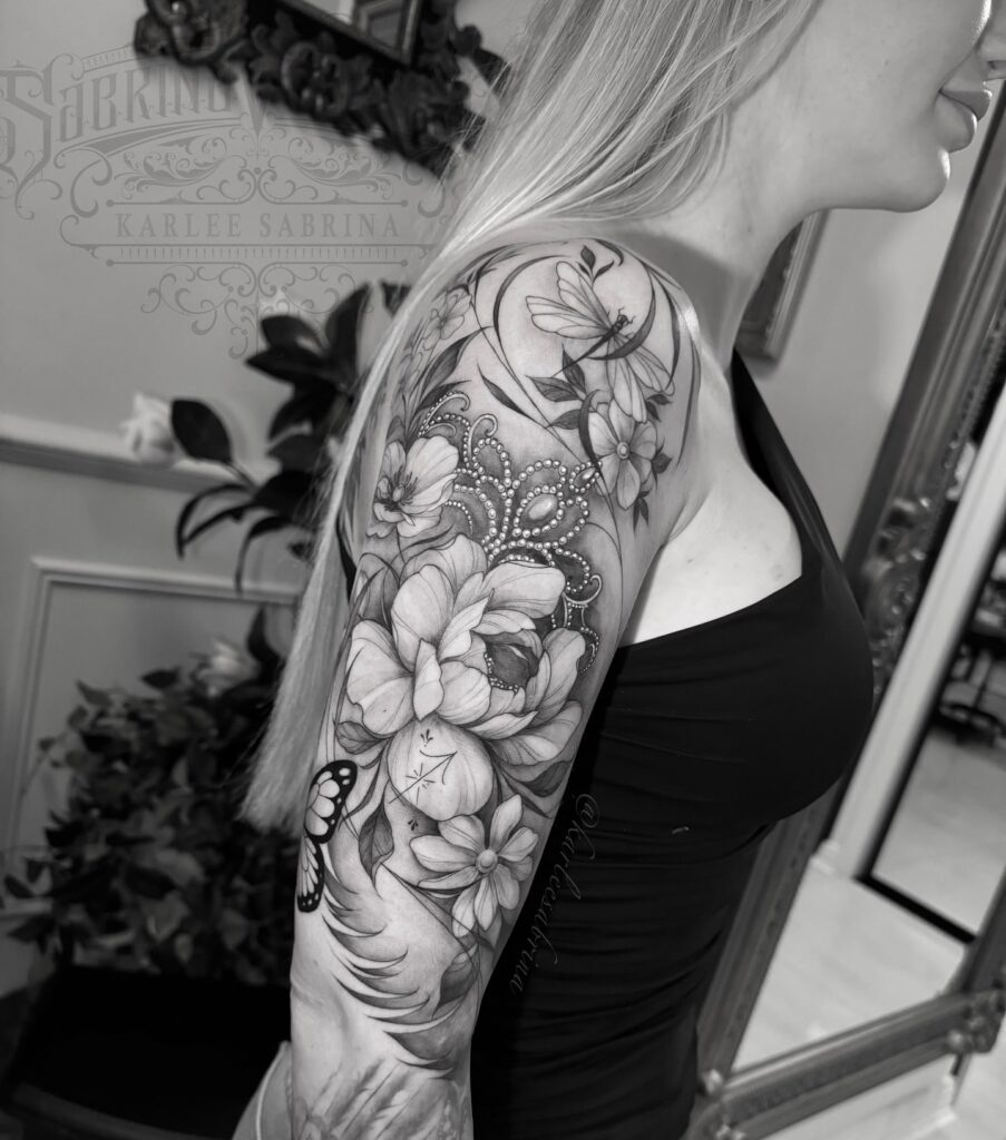 Elegant Floral Tattoo Sleeve with Butterflies and Ornamental Details 