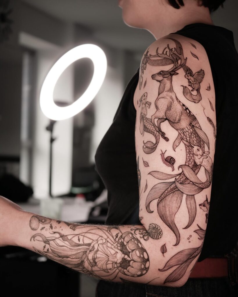 Fantasy marine tattoo sleeve featuring a mythical deer with mermaid-like elements 