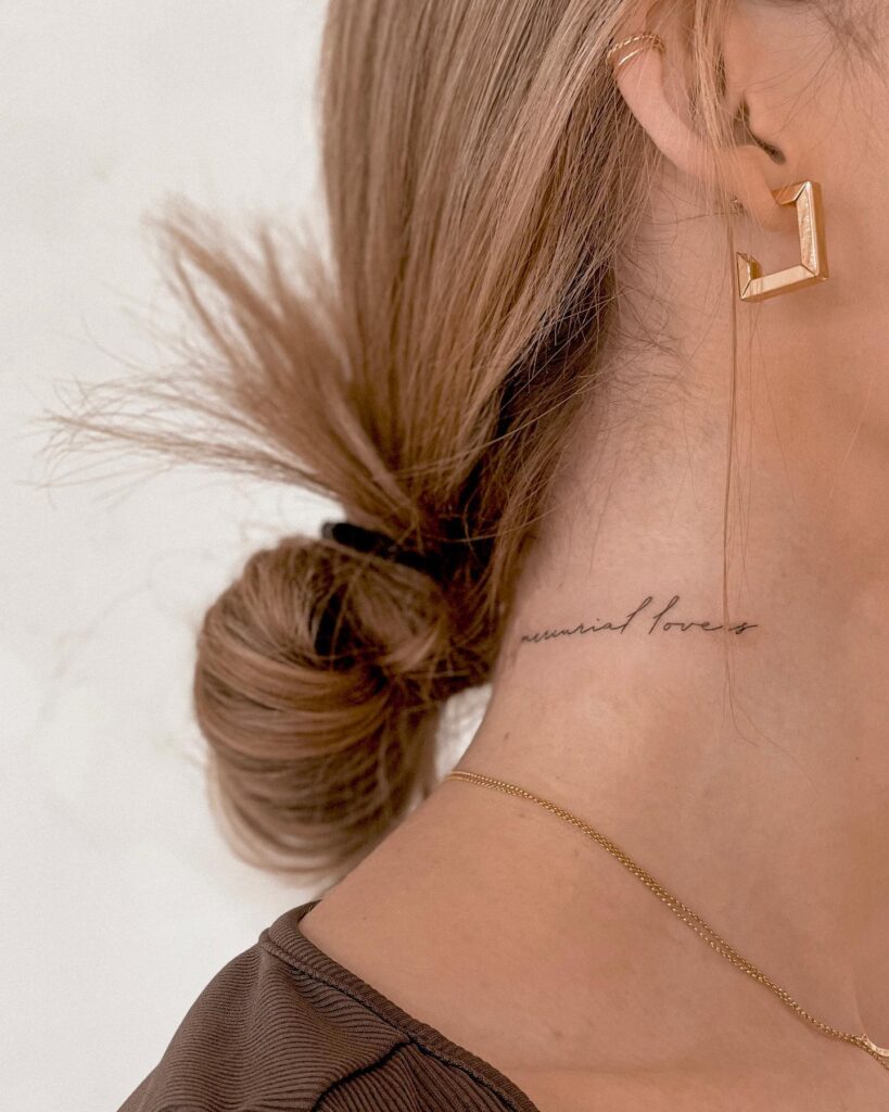 Fineline 'mercurial lovers' script lettering tattoo on the side of the neck in elegant line work celestial romance 
