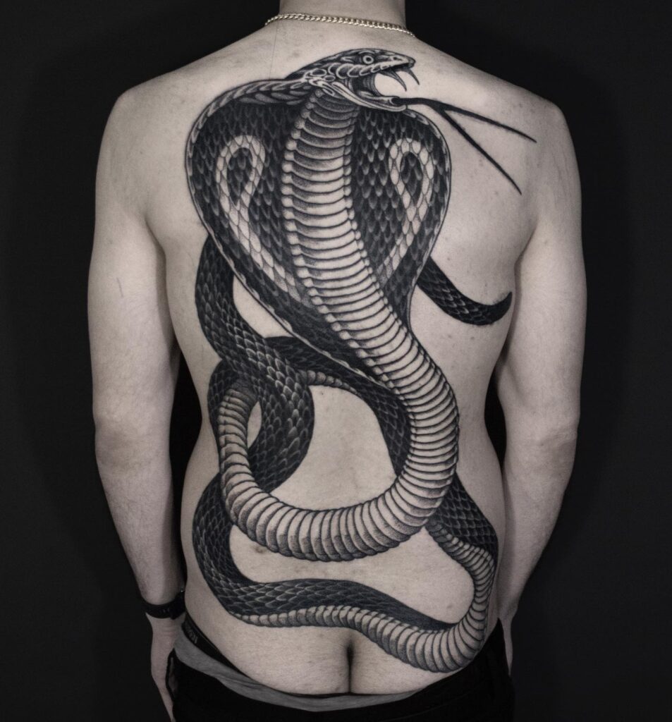 Fully covered back cobra tattoo with head up and tongue out: dark majesty 
