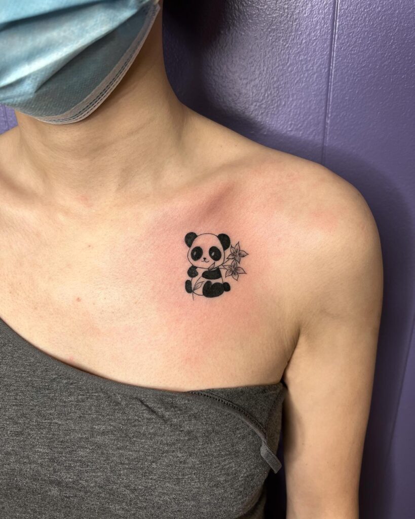 Girly cute little panda with flower tattoo design on the collarbone, a playful expression panda whimsy 