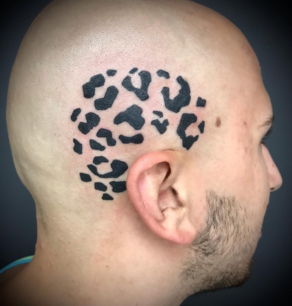 Head cheetah print tattoo above the ear for men 
