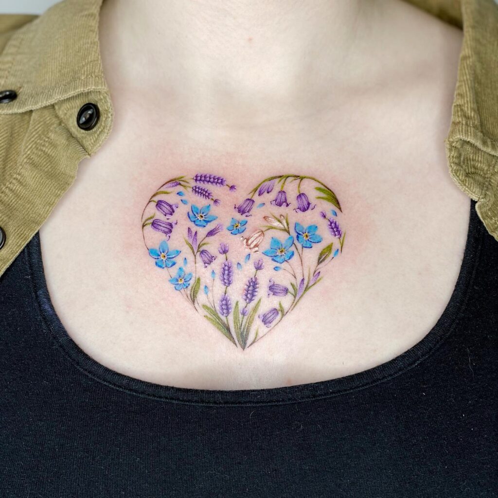 Heart-Shaped Tattoo Filled with Bluebells and Lavender on the Collarbone Center: Floral Love Nest 