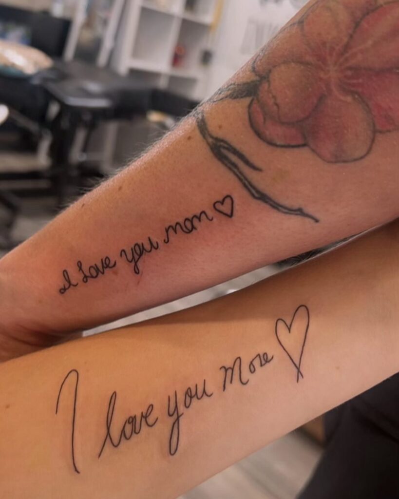 Heartfelt "I love you more" tattoo for mother and child 
