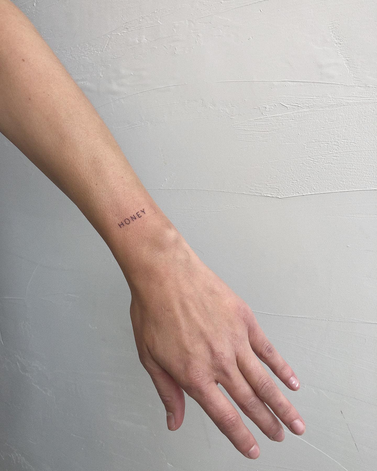 HONEY Minimalist Uppercase Wrist Tattoo Elegant and Subtle Design 