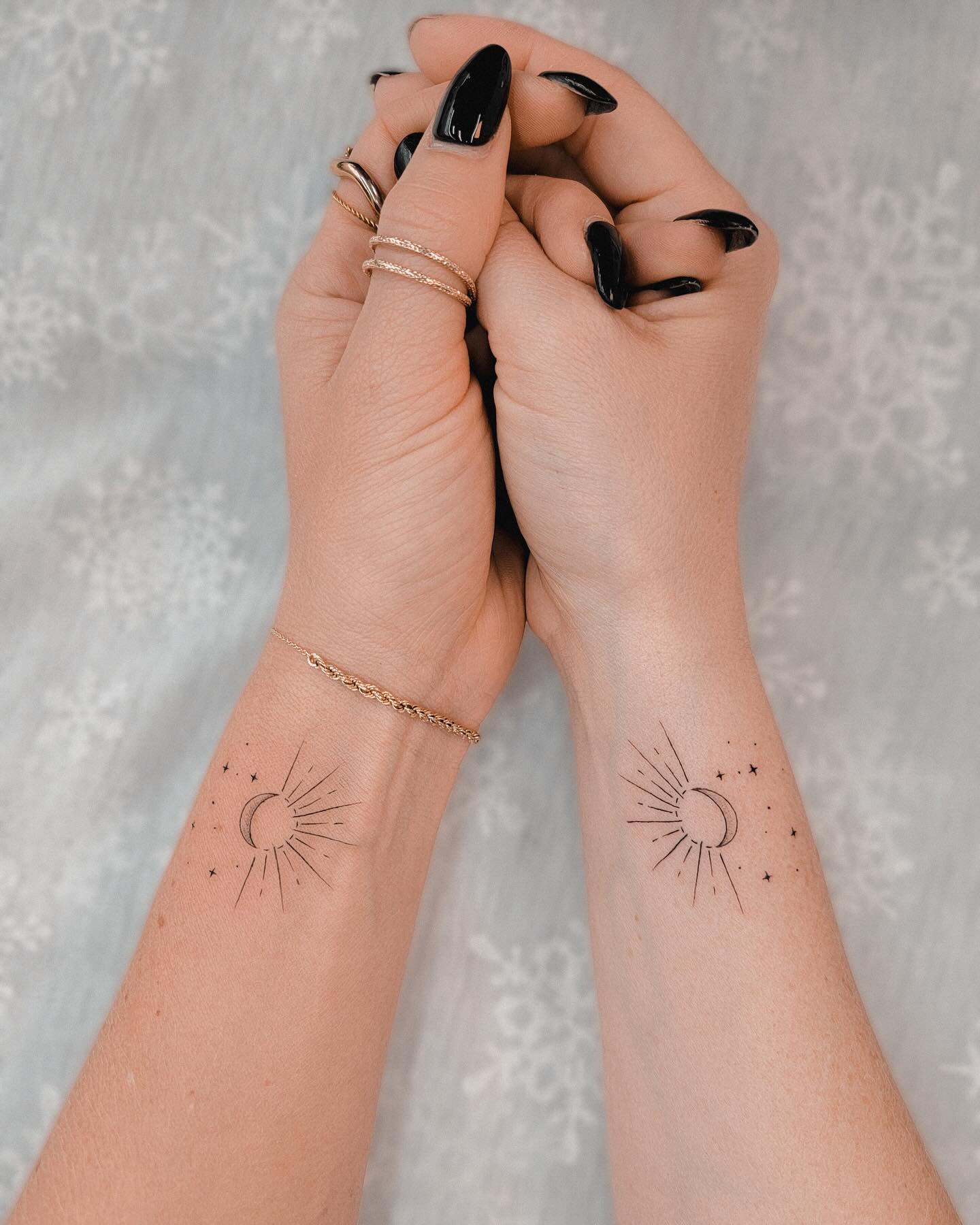 Matching crescent moon and sunray tattoos balance harmony 