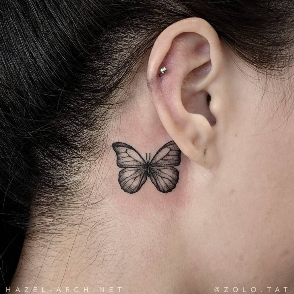 Minimalist beauty simple single butterfly tattoo behind the ear 