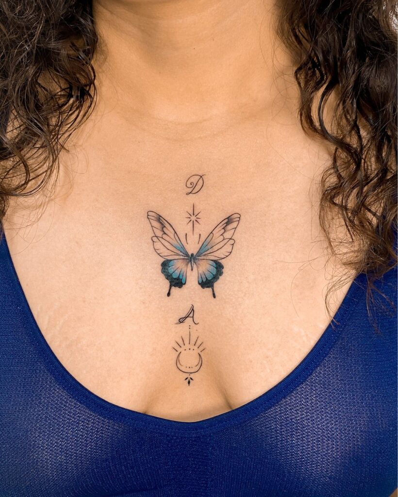 Outline blue butterfly upper chest tattoo for women delicate ink 