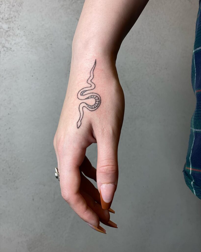 Outline snake tattoo serpent art on the hand
