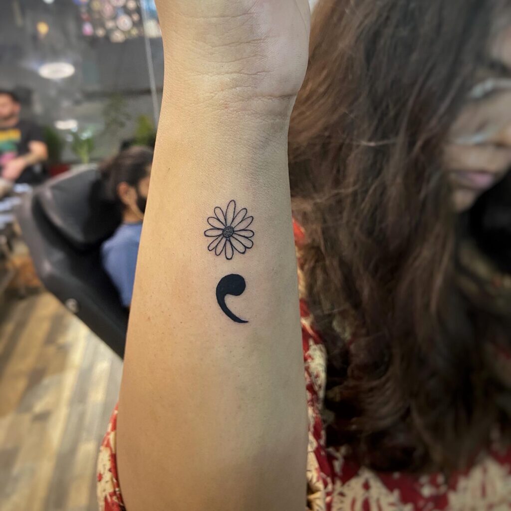 Semicolon Tattoo with Flowers on the Side of the Forearm: Floral Harmony 