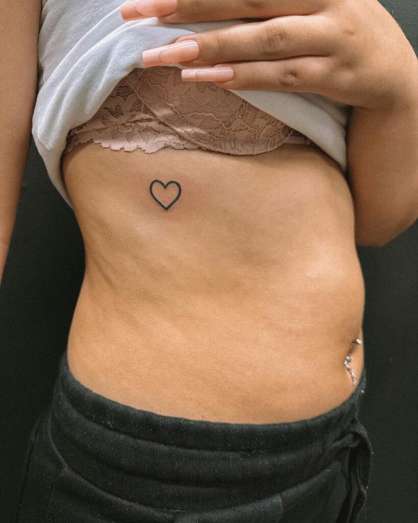 Stunning rib tattoo outline hearts feminine charm 