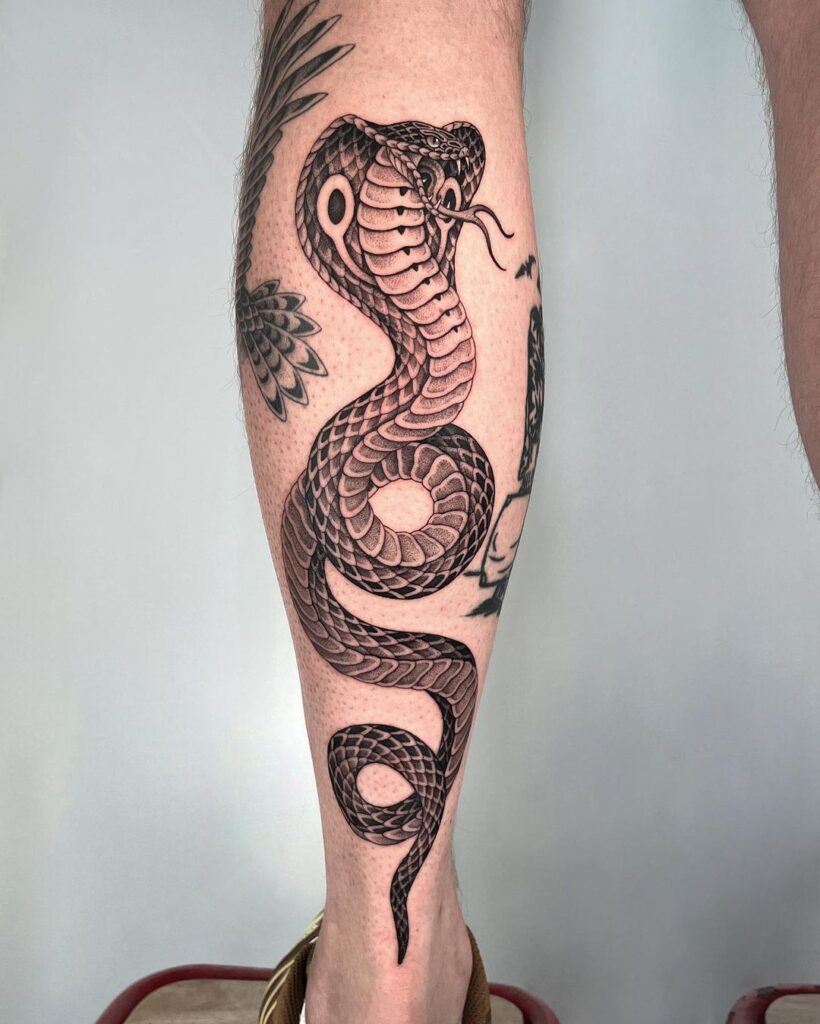 Traditional realistic cobra calf tattoo serpent's charismatic artistry