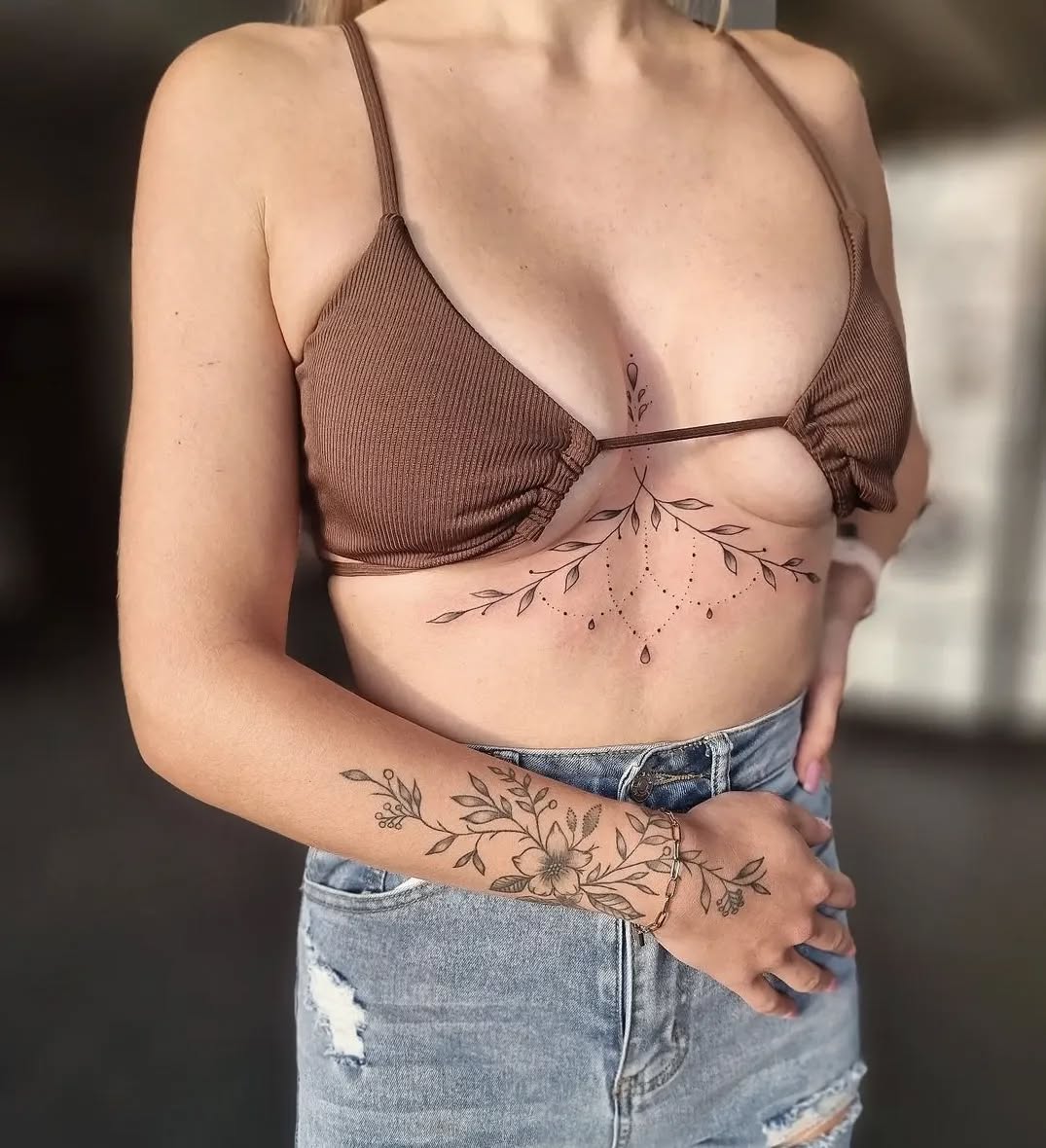 Elegant Floral Underboob Tattoo with Arm Accent